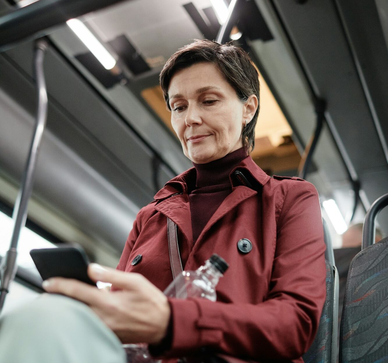 Adult Woman Traveling by Bus in City