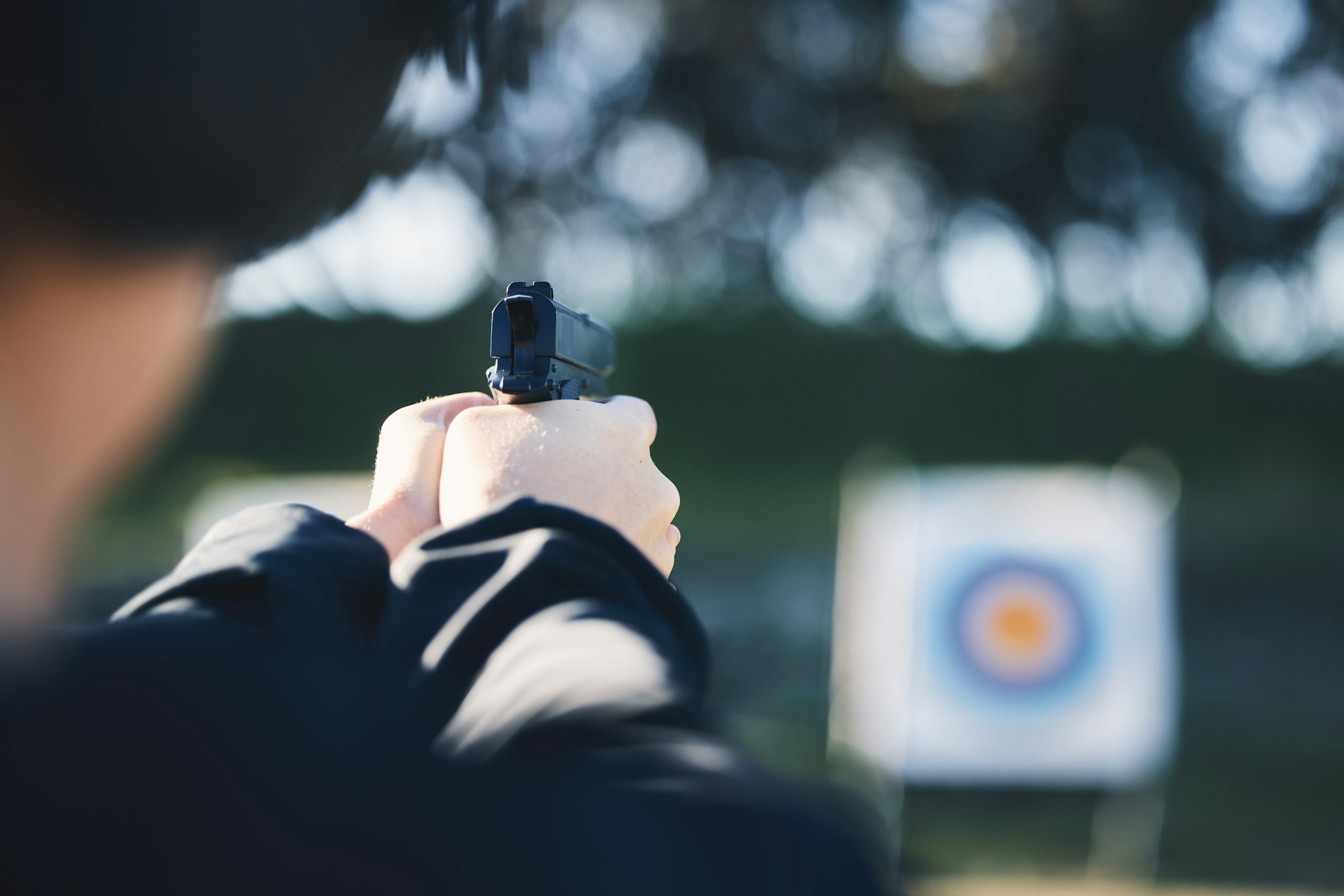 Firearm, target and person training outdoor at shooting range for game exercise or sports challenge